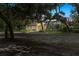 Charming, single-story home features a fountain, beautiful landscaping, and elegant Spanish moss-draped oak trees at 4885 State Road 11, De Leon Springs, FL 32130