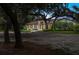 Charming, single-story home features a fountain, beautiful landscaping, and elegant Spanish moss-draped oak trees at 4885 State Road 11, De Leon Springs, FL 32130