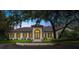This well-maintained single-story home has a fountain, a tile roof, and a well-manicured lawn at 4885 State Road 11, De Leon Springs, FL 32130