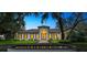 The beautifully landscaped, single-story home features a grand entrance and meticulous landscaping at 4885 State Road 11, De Leon Springs, FL 32130