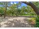 Expansive estate grounds featuring mature trees, a decorative fountain, and ample space at 4885 State Road 11, De Leon Springs, FL 32130