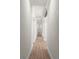 Hallway features wood-look flooring, recessed lighting, columns, and architectural details at 4885 State Road 11, De Leon Springs, FL 32130