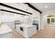 Spacious kitchen with large island, marble countertops, stainless steel appliances, and custom cabinetry at 4885 State Road 11, De Leon Springs, FL 32130