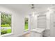 Bright pantry offering custom cabinets, shelving, and views of the landscaped yard at 4885 State Road 11, De Leon Springs, FL 32130