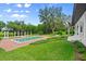 Relaxing pool surrounded by lush landscaping offers a tranquil escape in this luxurious backyard retreat at 4885 State Road 11, De Leon Springs, FL 32130