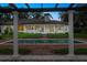 Beautiful pool with columns, a pergola, and lush landscaping, providing a luxurious backyard oasis at 4885 State Road 11, De Leon Springs, FL 32130