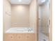 This bathroom has a white soaking tub and a glass enclosed shower at 5060 Cypress Branch Pt, Oviedo, FL 32765