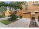 Charming two-story townhome with a well-maintained front yard, featuring a brick-paved driveway and manicured landscaping at 5060 Cypress Branch Pt, Oviedo, FL 32765