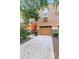 Two-story townhome with a brick-paved driveway, complimented by stone accents and tasteful landscaping at 5060 Cypress Branch Pt, Oviedo, FL 32765