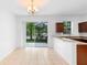 A Kitchen featuring an access bar, stainless steel sink and sliding glass door at 5060 Cypress Branch Pt, Oviedo, FL 32765
