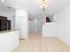 Bright living room featuring tile floors, modern chandelier, and seamless flow to other spaces at 5060 Cypress Branch Pt, Oviedo, FL 32765