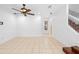 Open living room with tile flooring, neutral walls, ceiling fan, and natural light at 5060 Cypress Branch Pt, Oviedo, FL 32765