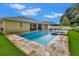 Gorgeous backyard showcases a large pool, spa, and meticulously designed landscaping for ultimate outdoor enjoyment at 508 Morgan Wood Dr, Deland, FL 32724