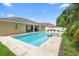 Expansive backyard showcases a large pool, spa, and outdoor seating areas perfect for entertaining guests at 508 Morgan Wood Dr, Deland, FL 32724