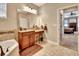 Bathroom featuring dual vanities, granite countertops, and a separate soaking tub at 508 Morgan Wood Dr, Deland, FL 32724