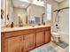 Bathroom with double vanity, granite countertops, and bath/shower combo at 508 Morgan Wood Dr, Deland, FL 32724