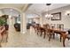 Inviting dining area featuring a wooden table and chairs, connecting to living spaces through arched openings at 508 Morgan Wood Dr, Deland, FL 32724