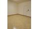 View of a clean garage space with epoxy flooring and a white door at 508 Morgan Wood Dr, Deland, FL 32724