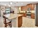 Well-equipped kitchen with granite counters, stainless steel appliances, and an adjacent breakfast nook at 508 Morgan Wood Dr, Deland, FL 32724