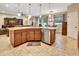Spacious kitchen island with granite countertops, seating, and views of the living area at 508 Morgan Wood Dr, Deland, FL 32724