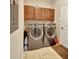 Functional laundry room with updated washer and dryer at 508 Morgan Wood Dr, Deland, FL 32724