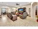 Spacious living room with comfortable seating, entertainment center, and open layout to dining area at 508 Morgan Wood Dr, Deland, FL 32724
