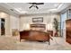 Spacious main bedroom with tray ceilings, carpeted floors, and ample natural light at 508 Morgan Wood Dr, Deland, FL 32724