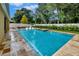 Inviting backyard pool and spa combination, beautifully landscaped with ample space for outdoor seating and recreation at 508 Morgan Wood Dr, Deland, FL 32724