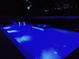 Elegant backyard pool with integrated loungers and hot tub features, enhancing the luxury outdoor experience at 508 Morgan Wood Dr, Deland, FL 32724