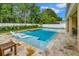Beautiful pool with submerged lounge chairs, a spa, and a spacious deck for relaxing and enjoying the outdoors at 508 Morgan Wood Dr, Deland, FL 32724