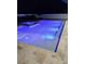Inviting backyard pool and spa featuring travertine tile, and color-changing lights at 508 Morgan Wood Dr, Deland, FL 32724