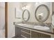 Bathroom featuring dual vanities with stylish mirrors, enhancing its functionality and aesthetic appeal at 510 Sandy Bluff Trl, Deland, FL 32724