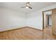Bright bedroom with hardwood floors and a door leading to another room at 510 Sandy Bluff Trl, Deland, FL 32724