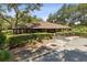 Charming clubhouse with covered outdoor seating and meticulously maintained landscaping at 510 Sandy Bluff Trl, Deland, FL 32724