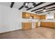 Bright kitchen featuring wood-look flooring, white countertops, and wooden cabinets at 510 Sandy Bluff Trl, Deland, FL 32724