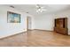 Open living room featuring wood floors, a ceiling fan, and large artwork on the wall at 510 Sandy Bluff Trl, Deland, FL 32724