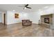 Hardwood floors, a brick fireplace, and ample natural light in the spacious living room at 510 Sandy Bluff Trl, Deland, FL 32724