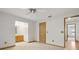 Bright main bedroom features carpet, ceiling fan, and an en-suite bathroom at 510 Sandy Bluff Trl, Deland, FL 32724