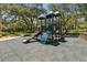 Community playground with modern play structures and a secure, padded ground surface at 510 Sandy Bluff Trl, Deland, FL 32724