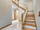 Elegant staircase with wood and patterned tile risers, connecting the home's levels at 510 Sandy Bluff Trl, Deland, FL 32724