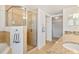 Bathroom featuring a step-in shower with glass enclosure and granite countertops at 5300 S Atlantic Ave # 12-401, New Smyrna Beach, FL 32169