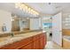 Bathroom with dual sinks, granite countertops, and step-in shower at 5300 S Atlantic Ave # 12-401, New Smyrna Beach, FL 32169