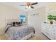 This bedroom is decorated with nautical-themed accents and has lots of natural light at 5300 S Atlantic Ave # 12-401, New Smyrna Beach, FL 32169