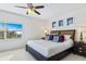 Restful bedroom with a plush bed and a view of the city at 5300 S Atlantic Ave # 12-401, New Smyrna Beach, FL 32169