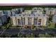 Beautiful condo building exterior showcasing ample parking and well-maintained landscaping at 5300 S Atlantic Ave # 12-401, New Smyrna Beach, FL 32169