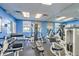 Community gym with several weight machines and a mirror on the wall at 5300 S Atlantic Ave # 12-401, New Smyrna Beach, FL 32169