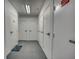 Hallway with storage units and a small welcome mat at 5300 S Atlantic Ave # 12-401, New Smyrna Beach, FL 32169