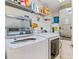 Laundry room featuring a washer and dryer and wire shelving for storage at 5300 S Atlantic Ave # 12-401, New Smyrna Beach, FL 32169