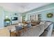 Relax in the spacious living room with comfortable seating and a stylish decor at 5300 S Atlantic Ave # 12-401, New Smyrna Beach, FL 32169