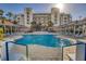 Resort-style pool area perfect for relaxation and entertainment, featuring cozy cabanas at 5300 S Atlantic Ave # 12-401, New Smyrna Beach, FL 32169